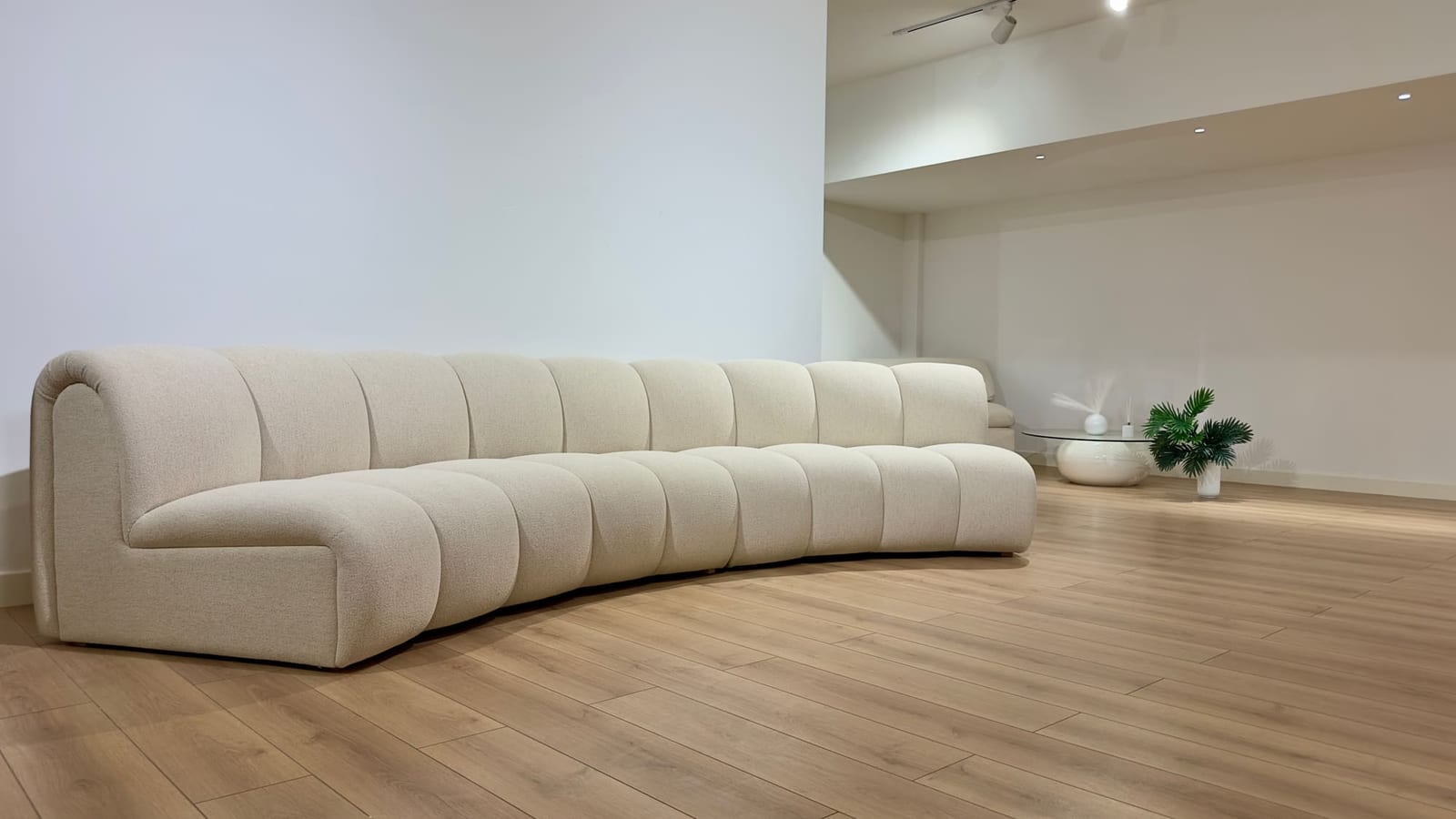 Curved boucle sofa on the Petra Home showroom floor